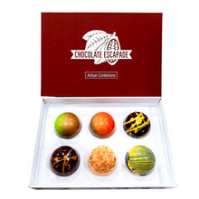 Load image into Gallery viewer, Box of assorted chocolate truffles with 'Chocolate Escapade' branding on a white background