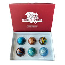 Load image into Gallery viewer, Box of six colorful dark chocolates with 'Chocolate Escapade' branding on a white background