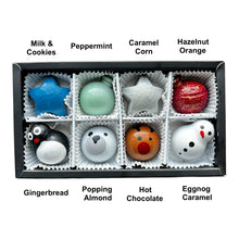 Load image into Gallery viewer, A boxed assortment of festive chocolates. Labels above and below identify the flavors: Milk & Cookies, Peppermint, Caramel Corn, Hazelnut Orange, Gingerbread, Popping Almond, Hot Chocolate, and Eggnog Caramel.
