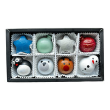 Load image into Gallery viewer, A set of eight chocolates arranged in a black gift box.