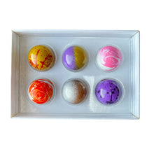 Load image into Gallery viewer, Set of colorful vegan chocolates in a white box on a white background