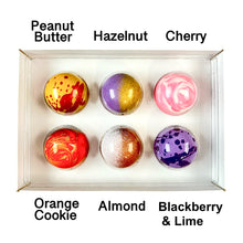 Load image into Gallery viewer, Fruit and nut chocolate in a box with flavor labels on a white background