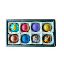 Load image into Gallery viewer, Box of colorful chocolates with decorative designs on a white background
