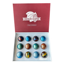 Load image into Gallery viewer, Box of assorted chocolate truffles with 'Chocolate Escapade' branding on a white background
