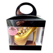 Load image into Gallery viewer, Gold chocolate shoe in a clear box with a black lid on a white background
