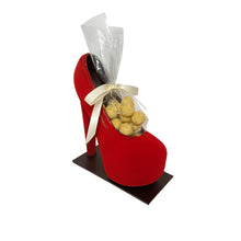 Load image into Gallery viewer, Red high-heeled chocolateshoe filled with creme brulee bites on a white background
