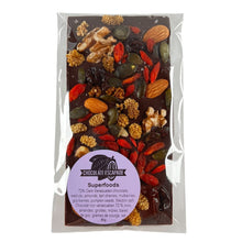 Load image into Gallery viewer, Dark chocolate bar with superfoods in a clear packaging on a white background
